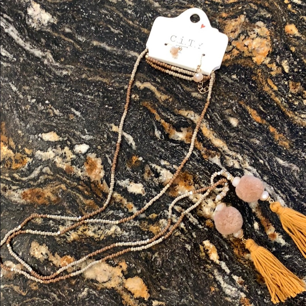 String style pompom necklace.